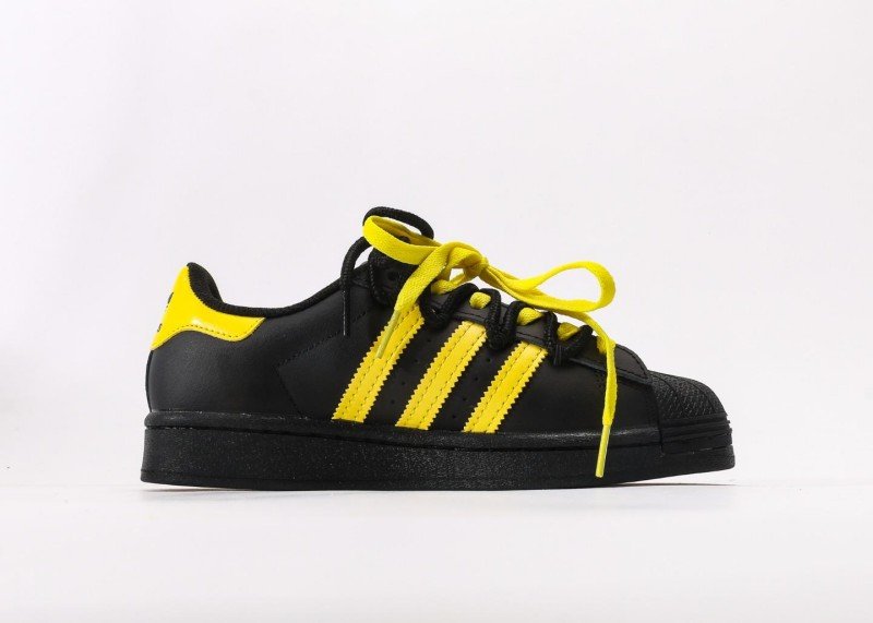 Adidas Superstar black and yellow cartoon sneakers - Image 2