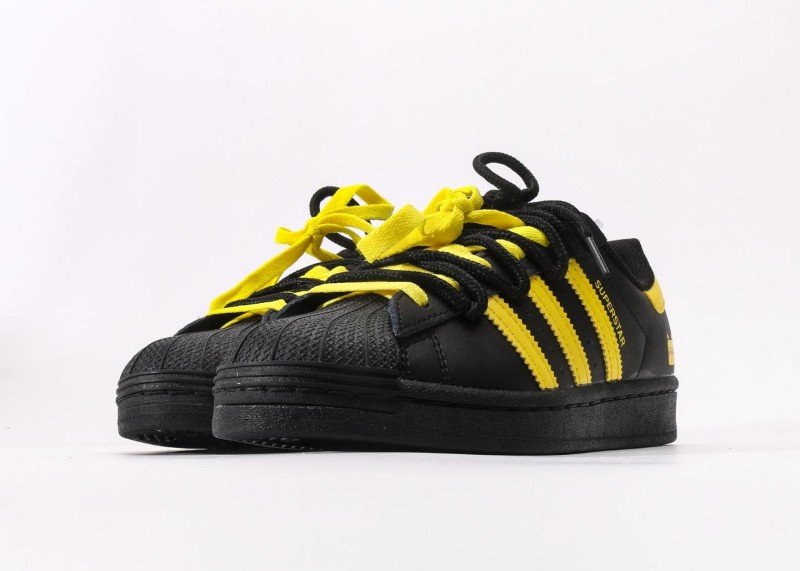 Adidas Superstar black and yellow cartoon sneakers - Image 5