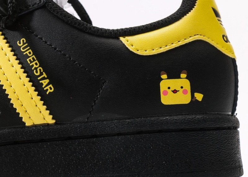 Adidas Superstar black and yellow cartoon sneakers - Image 7