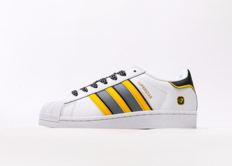 adidas-yellow-and-gray-striped-shell-toe-sneakers