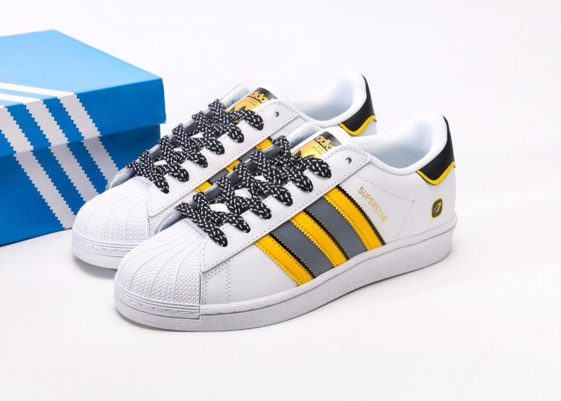 adidas-yellow-and-gray-striped-shell-toe-sneakers