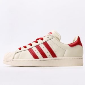 adidas-beige-and-red-striped-shell-toe-sneakers