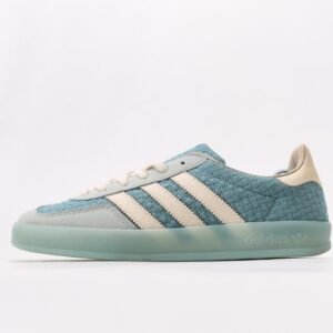 Design Features • Woven Texture Upper Upper made of light blue woven material with unique texture, lightweight and breathable, showcasing distinctive design style and enhancing overall fashion sense. • Off-White Stripes Design Three parallel off-white stripes on the side, extending from toe to midfoot, creating strong contrast with light blue upper, classic and versatile. • Light Green Transparent Sole Light green semi-transparent sole, lightweight with clear纹路; "adidas" and trefoil logo printed on sole side, highlighting brand identity. • Detailed Color Matching Light gray toe and heel parts transitioning naturally with light blue upper; off-white laces, tongue and heel lining, creating coordinated overall color scheme. Comfort Experience • Breathable Woven Material Light blue woven upper offers excellent breathability, effectively wicking away foot moisture and keeping feet dry, suitable for extended wear in spring and summer. • Lightweight Cushioned Sole Light green transparent sole is lightweight with moderate elasticity, providing good cushioning during walking; patterned纹路 enhances grip, adapting to various road surfaces. FAQ(Frequently Asked Questions) Q: Is the woven upper prone to snagging? How to maintain it for longer service life? A: The woven upper uses wear-resistant weaving technology and is not easily snagged under normal wear. Daily maintenance: gently brush with soft brush to remove dust; wipe minor stains with damp cloth and water, avoid rubbing; use shoe tree when storing to prevent texture deformation. Q: Will the light green transparent sole change color over time? How to maintain its transparency? A: Light green transparent sole may slightly oxidize and darken with prolonged sun exposure, which is normal for transparent materials. Store in shoe box away from direct sunlight; clean with water only, no detergent, air dry naturally to maintain transparency. Q: What clothing colors does it match? Any specific spring-summer outfit recommendations? A: Light blue colorway is fresh and bright, matching white, light blue, light green, beige and other light-colored clothing. Spring-summer suggestions: white T-shirt + light denim shorts or light blue dress for fresh look; sporty style with light gray tracksuit to highlight casual sportiness. Q: Is the sizing standard? Consistent with other Adidas casual models like STAN SMITH? A: Follows Adidas standard sizing, consistent with STAN SMITH and other casual models. Moderate fit with ample toe room, suitable for all foot types. Order your regular Adidas size, no need to size up or down.