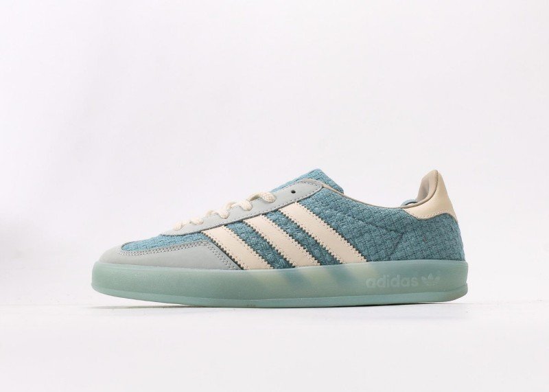 Design Features • Woven Texture Upper Upper made of light blue woven material with unique texture, lightweight and breathable, showcasing distinctive design style and enhancing overall fashion sense. • Off-White Stripes Design Three parallel off-white stripes on the side, extending from toe to midfoot, creating strong contrast with light blue upper, classic and versatile. • Light Green Transparent Sole Light green semi-transparent sole, lightweight with clear纹路; "adidas" and trefoil logo printed on sole side, highlighting brand identity. • Detailed Color Matching Light gray toe and heel parts transitioning naturally with light blue upper; off-white laces, tongue and heel lining, creating coordinated overall color scheme. Comfort Experience • Breathable Woven Material Light blue woven upper offers excellent breathability, effectively wicking away foot moisture and keeping feet dry, suitable for extended wear in spring and summer. • Lightweight Cushioned Sole Light green transparent sole is lightweight with moderate elasticity, providing good cushioning during walking; patterned纹路 enhances grip, adapting to various road surfaces. FAQ(Frequently Asked Questions) Q: Is the woven upper prone to snagging? How to maintain it for longer service life? A: The woven upper uses wear-resistant weaving technology and is not easily snagged under normal wear. Daily maintenance: gently brush with soft brush to remove dust; wipe minor stains with damp cloth and water, avoid rubbing; use shoe tree when storing to prevent texture deformation. Q: Will the light green transparent sole change color over time? How to maintain its transparency? A: Light green transparent sole may slightly oxidize and darken with prolonged sun exposure, which is normal for transparent materials. Store in shoe box away from direct sunlight; clean with water only, no detergent, air dry naturally to maintain transparency. Q: What clothing colors does it match? Any specific spring-summer outfit recommendations? A: Light blue colorway is fresh and bright, matching white, light blue, light green, beige and other light-colored clothing. Spring-summer suggestions: white T-shirt + light denim shorts or light blue dress for fresh look; sporty style with light gray tracksuit to highlight casual sportiness. Q: Is the sizing standard? Consistent with other Adidas casual models like STAN SMITH? A: Follows Adidas standard sizing, consistent with STAN SMITH and other casual models. Moderate fit with ample toe room, suitable for all foot types. Order your regular Adidas size, no need to size up or down.