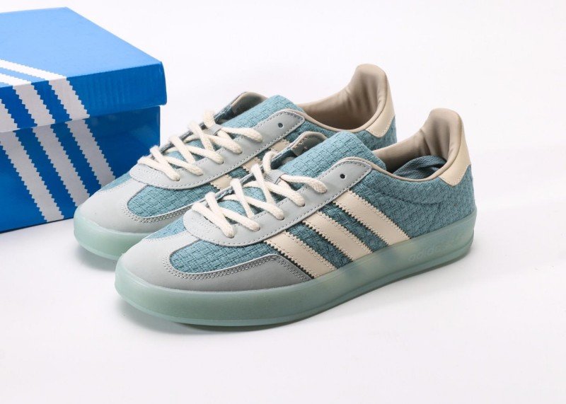 Design Features • Woven Texture Upper Upper made of light blue woven material with unique texture, lightweight and breathable, showcasing distinctive design style and enhancing overall fashion sense. • Off-White Stripes Design Three parallel off-white stripes on the side, extending from toe to midfoot, creating strong contrast with light blue upper, classic and versatile. • Light Green Transparent Sole Light green semi-transparent sole, lightweight with clear纹路; "adidas" and trefoil logo printed on sole side, highlighting brand identity. • Detailed Color Matching Light gray toe and heel parts transitioning naturally with light blue upper; off-white laces, tongue and heel lining, creating coordinated overall color scheme. Comfort Experience • Breathable Woven Material Light blue woven upper offers excellent breathability, effectively wicking away foot moisture and keeping feet dry, suitable for extended wear in spring and summer. • Lightweight Cushioned Sole Light green transparent sole is lightweight with moderate elasticity, providing good cushioning during walking; patterned纹路 enhances grip, adapting to various road surfaces. FAQ(Frequently Asked Questions) Q: Is the woven upper prone to snagging? How to maintain it for longer service life? A: The woven upper uses wear-resistant weaving technology and is not easily snagged under normal wear. Daily maintenance: gently brush with soft brush to remove dust; wipe minor stains with damp cloth and water, avoid rubbing; use shoe tree when storing to prevent texture deformation. Q: Will the light green transparent sole change color over time? How to maintain its transparency? A: Light green transparent sole may slightly oxidize and darken with prolonged sun exposure, which is normal for transparent materials. Store in shoe box away from direct sunlight; clean with water only, no detergent, air dry naturally to maintain transparency. Q: What clothing colors does it match? Any specific spring-summer outfit recommendations? A: Light blue colorway is fresh and bright, matching white, light blue, light green, beige and other light-colored clothing. Spring-summer suggestions: white T-shirt + light denim shorts or light blue dress for fresh look; sporty style with light gray tracksuit to highlight casual sportiness. Q: Is the sizing standard? Consistent with other Adidas casual models like STAN SMITH? A: Follows Adidas standard sizing, consistent with STAN SMITH and other casual models. Moderate fit with ample toe room, suitable for all foot types. Order your regular Adidas size, no need to size up or down.